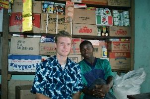Jeremy Gernand and Amadou Diallo, a local shop keeper in 
			Kankalabe, Guinea. Amadou had the first refrigerated drinks available in town in 1999.